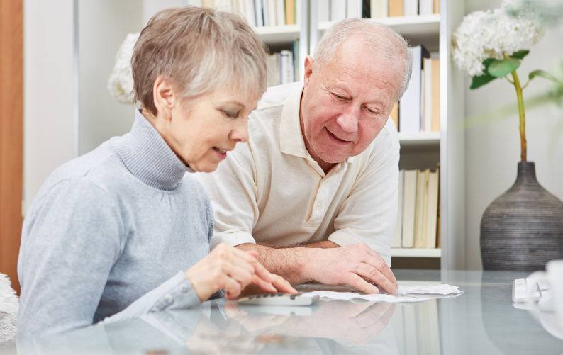 Man and woman looking at senior living options